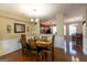 Dining area with hardwood floors, elegant lighting, and seamless access to the living spaces at 6089 Indian Wood Se Cir, Mableton, GA 30126