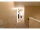 Upstairs hallway with carpeted floor leading to other areas of the house with neutral paint at 6089 Indian Wood Se Cir, Mableton, GA 30126