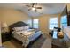 Comfortable bedroom with a king sized bed, ceiling fan, natural light and a contemporary design at 6089 Indian Wood Se Cir, Mableton, GA 30126