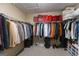 Well-organized walk-in closet with shelving, hanging racks, and ample storage space for clothes and accessories at 6089 Indian Wood Se Cir, Mableton, GA 30126
