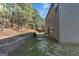 Landscaped backyard featuring a patio and lush greenery, ideal for relaxing and enjoying nature at 820 Lake Chase, Fairburn, GA 30213