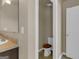 Bathroom featuring a toilet and vanity sink at 820 Lake Chase, Fairburn, GA 30213