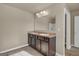 Bathroom with double vanity and tiled floors at 820 Lake Chase, Fairburn, GA 30213