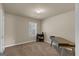 The bedroom has neutral walls, carpet, and a small bookcase at 820 Lake Chase, Fairburn, GA 30213