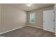 The bedroom has neutral walls, carpet, and a window with blinds at 820 Lake Chase, Fairburn, GA 30213