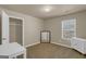 Bedroom featuring neutral walls, carpet, closet, a window and white furniture at 820 Lake Chase, Fairburn, GA 30213