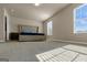 Bright bedroom with large windows and neutral tones at 820 Lake Chase, Fairburn, GA 30213