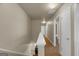 Hallway upstairs featuring neutral walls, carpet, and access to multiple rooms with white doors at 820 Lake Chase, Fairburn, GA 30213