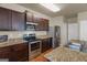 Well-equipped kitchen with stainless steel appliances, granite countertops, and ample storage at 820 Lake Chase, Fairburn, GA 30213