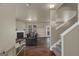 A living room featuring hardwood floors, a fireplace, and stairway at 820 Lake Chase, Fairburn, GA 30213