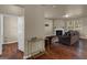 A living room with hardwood floors, a fireplace, and furniture at 820 Lake Chase, Fairburn, GA 30213