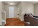 Inviting living room with hardwood floors, comfortable seating, and a welcoming entryway at 820 Lake Chase, Fairburn, GA 30213