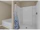 Shower tub combo with white tiling and blue shower curtain at 820 Lake Chase, Fairburn, GA 30213