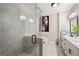 Modern bathroom with a glass-enclosed shower, double vanity, and elegant fixtures at 3028 Pruitt Ln, Smyrna, GA 30080