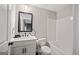 Well-lit bathroom features a stylish mirror, sleek vanity, and a standard toilet and tub combination at 3028 Pruitt Ln, Smyrna, GA 30080