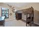 Fun bedroom with a wood frame lofted bed and spider Personal decorations for a growing boy at 3028 Pruitt Ln, Smyrna, GA 30080