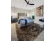 Comfortable bedroom with stylish decor, a modern ceiling fan, and a cozy rug at 3028 Pruitt Ln, Smyrna, GA 30080