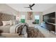 Comfortable bedroom featuring a stylish bed, a unique hanging chair, and modern decor at 3028 Pruitt Ln, Smyrna, GA 30080