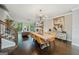 Elegant dining room featuring a modern chandelier, sleek table, and open floor plan at 3028 Pruitt Ln, Smyrna, GA 30080