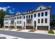 Charming townhomes featuring a light exterior, garage, and manicured landscaping at 3028 Pruitt Ln, Smyrna, GA 30080