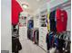 Spacious walk-in closet with custom shelves and hanging racks provides ample storage and organization at 3028 Pruitt Ln, Smyrna, GA 30080
