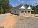 Lovely single-story home with white siding, gray brick, and a newly installed roof at 95 Rome St, Temple, GA 30179