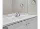 Clean bathroom features a bright white vanity, countertop, faucet, and towel hangers above at 1372 Hollenbeck Ln, Riverdale, GA 30296