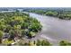 Expansive aerial view of a lakeside home with a private dock and lush green surroundings at 8655 Shoreline Dr, Jonesboro, GA 30236