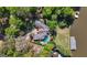 Stunning aerial photograph features a lake house with a pool and a dock for boats at 8655 Shoreline Dr, Jonesboro, GA 30236