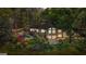 Stunning aerial view of the expansive property with a pool, lush landscaping, and lake access, showcasing its premier location at 8655 Shoreline Dr, Jonesboro, GA 30236