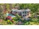 Lush backyard oasis with pool, patio, mature trees, and an outdoor entertainment area, providing an inviting retreat at 8655 Shoreline Dr, Jonesboro, GA 30236