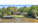 Beautiful waterfront home with private dock, lush greenery, and serene lake views, ideal for relaxation and recreation at 8655 Shoreline Dr, Jonesboro, GA 30236