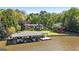 Waterfront home with private dock, lush greenery, and lake views, an outdoor haven for relaxation and recreation at 8655 Shoreline Dr, Jonesboro, GA 30236