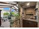 Unique stone bar area overlooking a living space, boasting elegant decor, and lake views at 8655 Shoreline Dr, Jonesboro, GA 30236