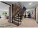 Inviting basement stairwell with stone accents, leading to a finished basement and lakeside view at 8655 Shoreline Dr, Jonesboro, GA 30236