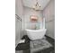 Elegant bathroom featuring a freestanding tub, stylish fixtures and a serene ambiance at 8655 Shoreline Dr, Jonesboro, GA 30236