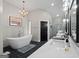 Luxurious bathroom features a soaking tub, double vanity, modern fixtures and elegant design at 8655 Shoreline Dr, Jonesboro, GA 30236