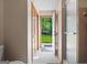 Bathroom featuring tile floor, wooden door to the backyard, and glass enclosed shower at 8655 Shoreline Dr, Jonesboro, GA 30236
