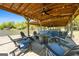 Covered boat dock with chairs and a bar area overlooking the tranquil lake, perfect for waterfront relaxation at 8655 Shoreline Dr, Jonesboro, GA 30236