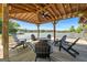 Covered boat dock with Adirondack chairs and string lights, creating an inviting lakeside retreat at 8655 Shoreline Dr, Jonesboro, GA 30236