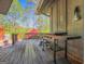 Outdoor deck with a large Blackstone grill and lush greenery, ideal for outdoor cooking and enjoying the natural surroundings at 8655 Shoreline Dr, Jonesboro, GA 30236