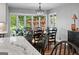 Elegant dining room with bay window offering a scenic view at 8655 Shoreline Dr, Jonesboro, GA 30236