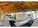A boat sits inside a covered boat dock with a lift, providing convenient storage and protection for watercraft and easy lake access at 8655 Shoreline Dr, Jonesboro, GA 30236
