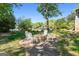 Backyard fire pit area with chairs and lush landscaping offering picturesque lake views at 8655 Shoreline Dr, Jonesboro, GA 30236