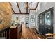 Welcoming foyer with high ceilings, hardwood floors, and an open view into the kitchen at 8655 Shoreline Dr, Jonesboro, GA 30236