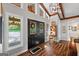 Bright foyer with high ceilings, statement lighting, decorative glass doors and hardwood floors at 8655 Shoreline Dr, Jonesboro, GA 30236