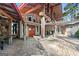Stunning entrance featuring stone columns, wooden beams, and double doors, creating an elegant and inviting entry at 8655 Shoreline Dr, Jonesboro, GA 30236