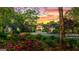 Lovely home showcasing vibrant landscaping and a cozy front porch, creating a warm and inviting atmosphere at 8655 Shoreline Dr, Jonesboro, GA 30236