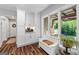 Charming kitchen with white cabinets, granite counter and a window bench for enjoying the outdoor scenery at 8655 Shoreline Dr, Jonesboro, GA 30236