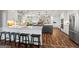 Open-concept kitchen featuring a center island, stainless steel appliances, and modern finishes at 8655 Shoreline Dr, Jonesboro, GA 30236
